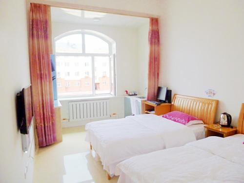 Imagen de la habitación del 伊春市汤旺河缘梦家庭旅馆. Foto 8