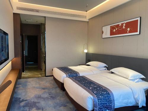 Imagen de la habitación del 云瑞凤凰酒店. Foto 15