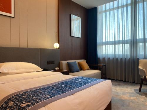 Imagen de la habitación del 云瑞凤凰酒店. Foto 18