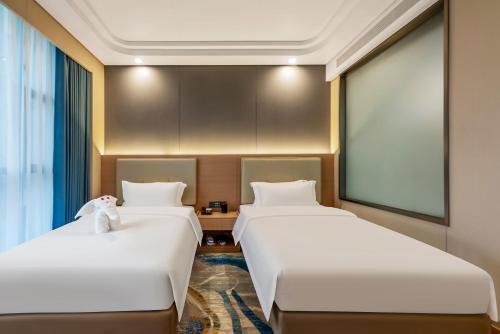Imagen de la habitación del 厦门探索酒店. Foto 20