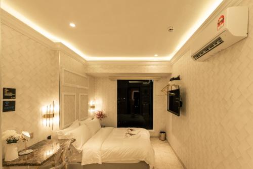 Imagen de la habitación del AJ Residence - Above Peppermint Asia City. Foto 17