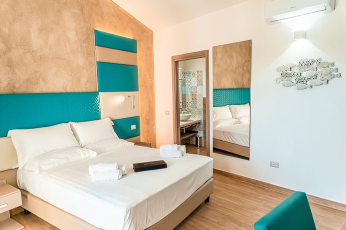 Imagen de la habitación del AQUA SARDINIA Boutique Hotel. Foto 12