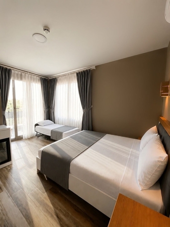 Imagen de la habitación del AURORA SIĞACIK HOTEL. Foto 1