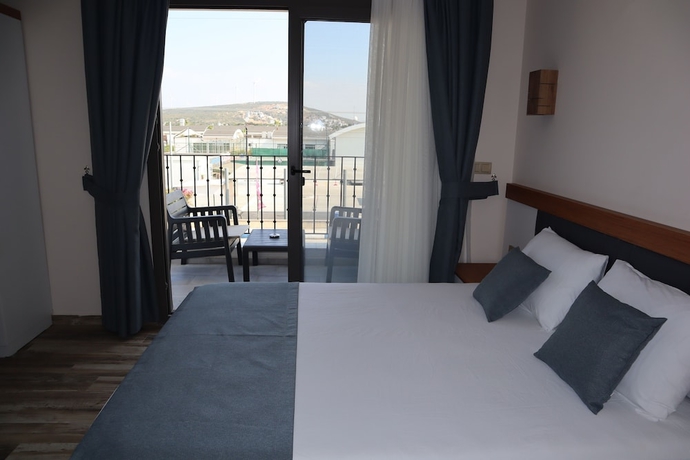 Imagen de la habitación del AURORA SIĞACIK HOTEL. Foto 4