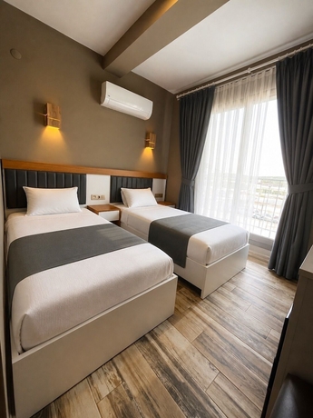 Imagen de la habitación del AURORA SIĞACIK HOTEL. Foto 5