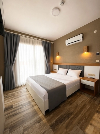 Imagen de la habitación del AURORA SIĞACIK HOTEL. Foto 7