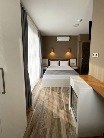 Imagen de la habitación del AURORA SIĞACIK HOTEL. Foto 8