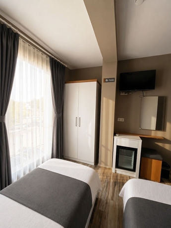Imagen de la habitación del AURORA SIĞACIK HOTEL. Foto 10