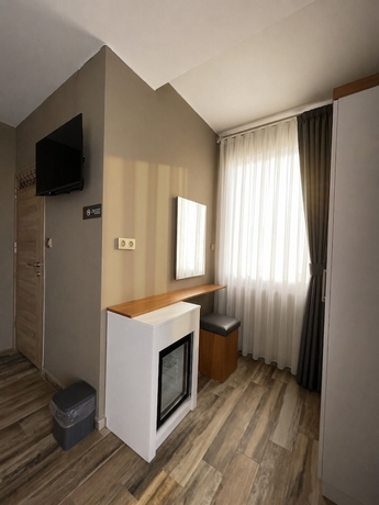 Imagen de la habitación del AURORA SIĞACIK HOTEL. Foto 11