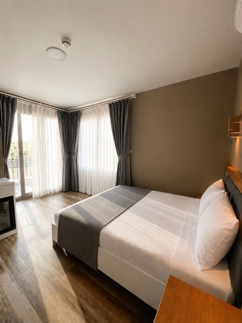 Imagen de la habitación del AURORA SIĞACIK HOTEL. Foto 12