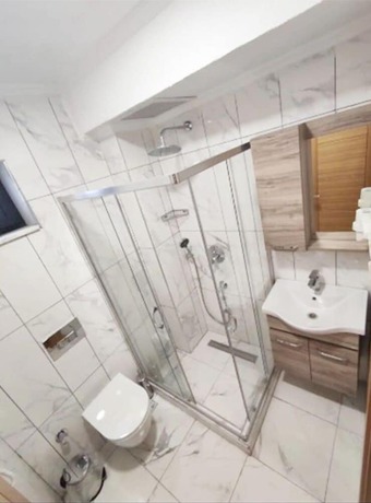 Imagen de la habitación del AZAD HOMES UNKAPANI. Foto 2