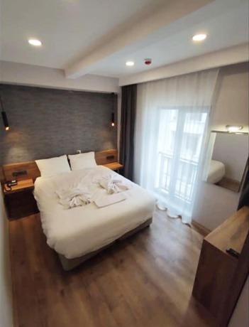 Imagen de la habitación del AZAD HOMES UNKAPANI. Foto 10