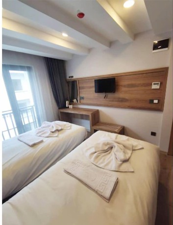 Imagen de la habitación del AZAD HOMES UNKAPANI. Foto 12