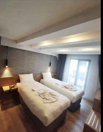 Imagen de la habitación del AZAD HOMES UNKAPANI. Foto 13