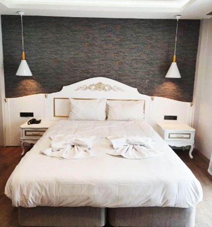 Imagen de la habitación del AZAD HOMES UNKAPANI. Foto 19