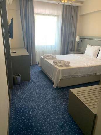 Imagen de la habitación del Acar Suite Hotel. Foto 13