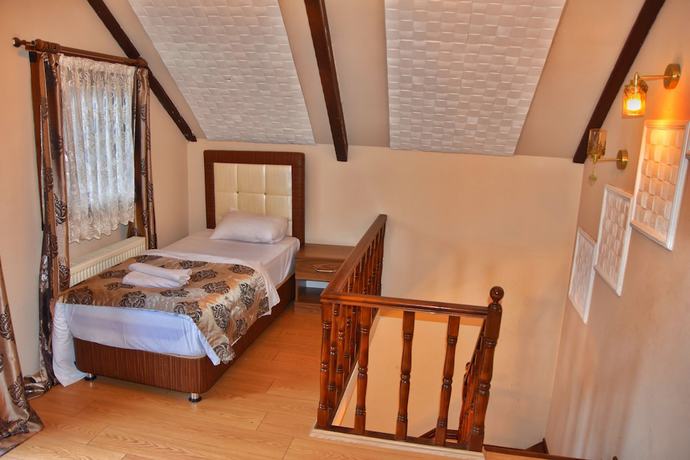 Imagen de la habitación del Ada Bungalow Hotel. Foto 2
