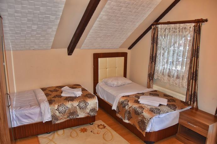 Imagen de la habitación del Ada Bungalow Hotel. Foto 7