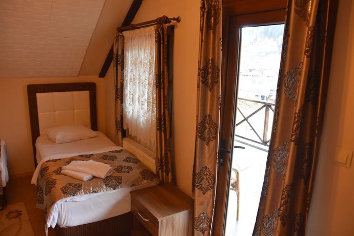 Imagen de la habitación del Ada Bungalow Hotel. Foto 11