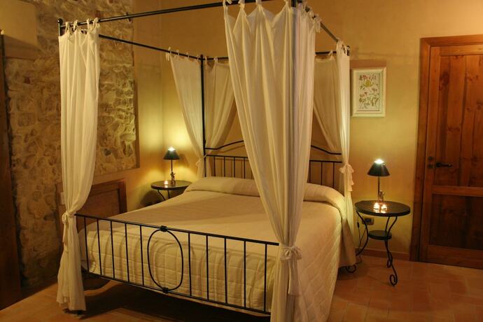 Imagen de la habitación del Agriturismo Chiusa di Carlo. Foto 18