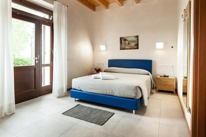 Imagen de la habitación del Agriturismo Corte Tonolli. Foto 15