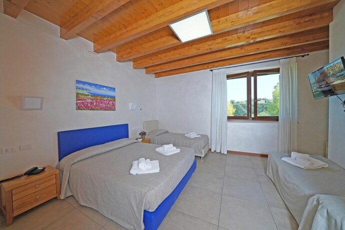 Imagen de la habitación del Agriturismo Corte Tonolli. Foto 26