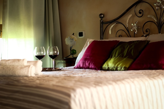 Imagen de la habitación del Agriturismo Millefiori Corte delle Rose. Foto 2