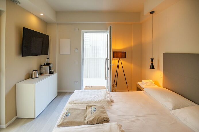 Imagen de la habitación del Ah Porticcioli boutique apartments. Foto 18