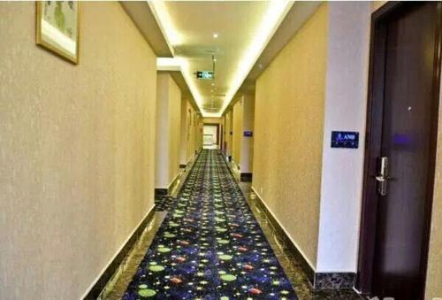 Imagen de la habitación del Aiqinhai International Business Hotel. Foto 8