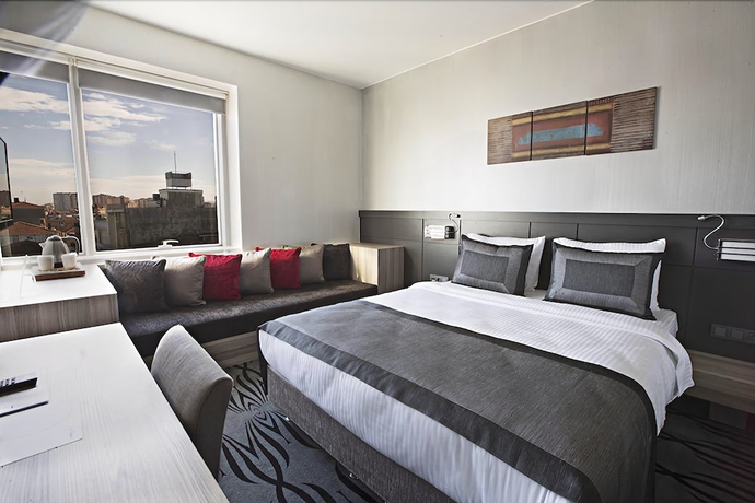 Imagen de la habitación del Akoni Hotel. Foto 15