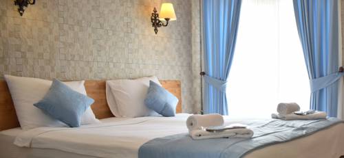 Imagen de la habitación del Aksu Hotel Alacati. Foto 1
