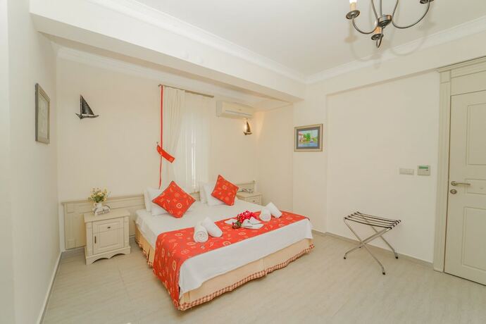 Imagen de la habitación del Alacati Marina Palace Otel. Foto 13