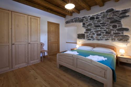 Imagen de la habitación del Albergo Diffuso Sutrio Zoncolan. Foto 2