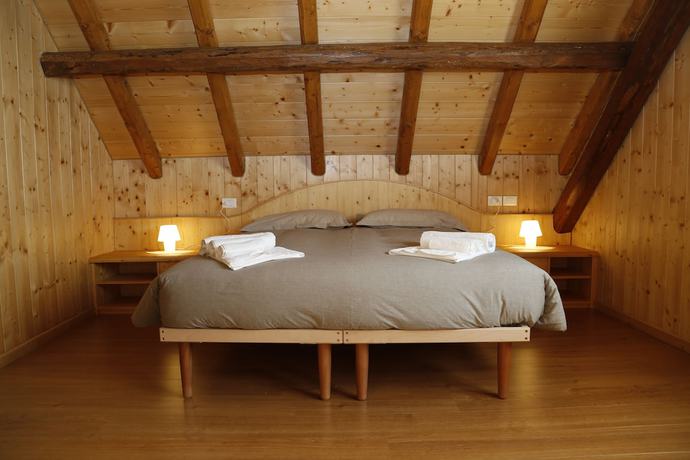 Imagen de la habitación del Albergo Diffuso Zoncolan. Foto 4
