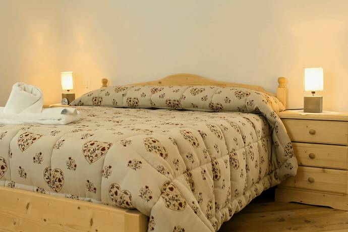 Imagen de la habitación del Albergo Diffuso Zoncolan. Foto 9