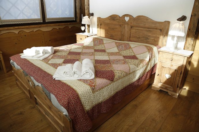 Imagen de la habitación del Albergo Diffuso Zoncolan. Foto 11
