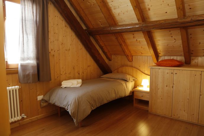 Imagen de la habitación del Albergo Diffuso Zoncolan. Foto 14