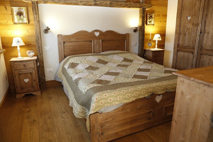 Imagen de la habitación del Albergo Diffuso Zoncolan. Foto 15