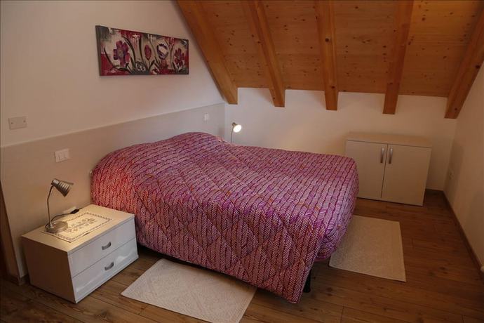 Imagen de la habitación del Albergo Diffuso Zoncolan. Foto 16