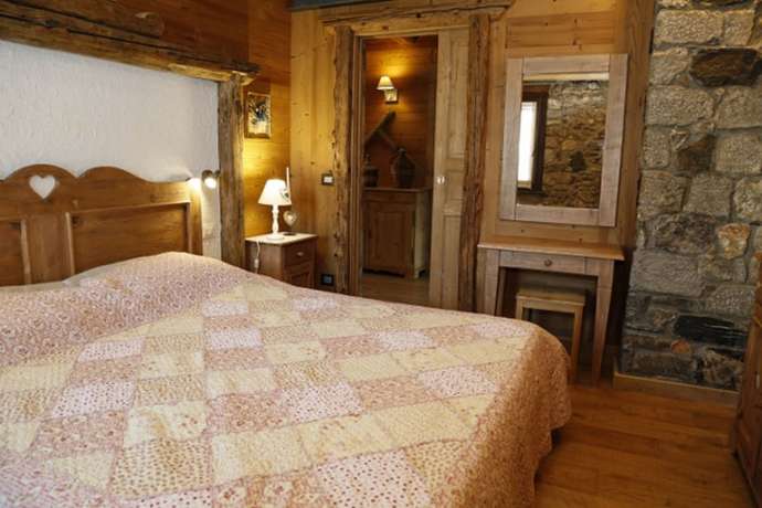 Imagen de la habitación del Albergo Diffuso Zoncolan. Foto 17