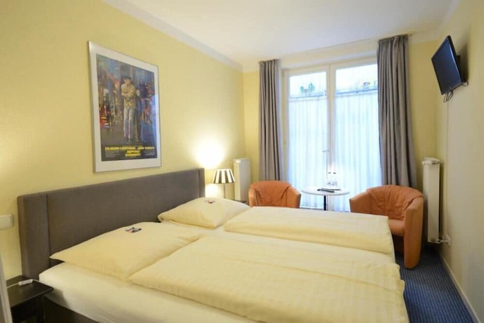Imagen de la habitación del Alpha Hotel-Pension. Foto 5