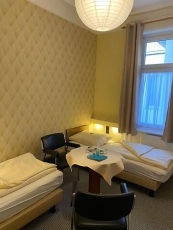 Imagen de la habitación del Alpha Hotel-Pension. Foto 6