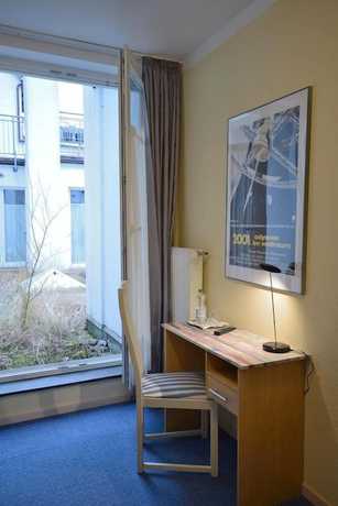 Imagen de la habitación del Alpha Hotel-Pension. Foto 10