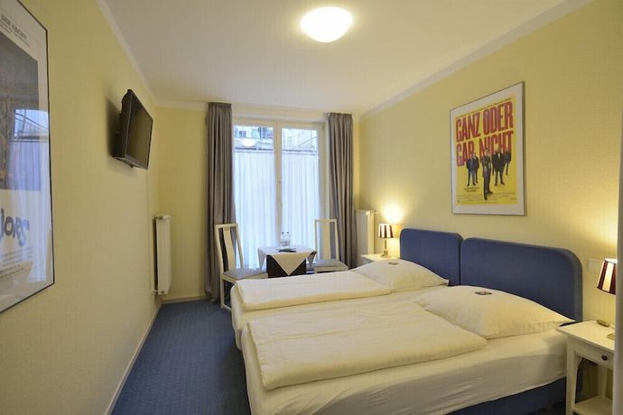 Imagen de la habitación del Alpha Hotel-Pension. Foto 12