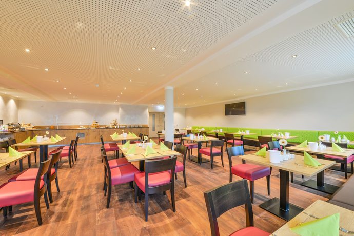 Imagen del bar/restaurante del Ammi Hotel Garni. Foto 6