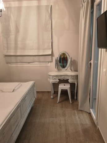 Imagen de la habitación del Ammos Luxury Suites. Foto 5