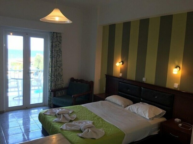 Imagen de la habitación del Amoudi Studios Apartments Hotel. Foto 28