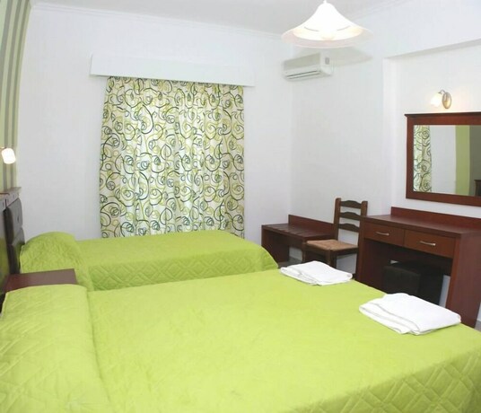 Imagen de la habitación del Amoudi Studios Apartments Hotel. Foto 29