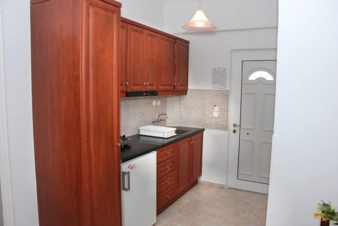 Imagen de la habitación del Amoudi Studios Apartments Hotel. Foto 34