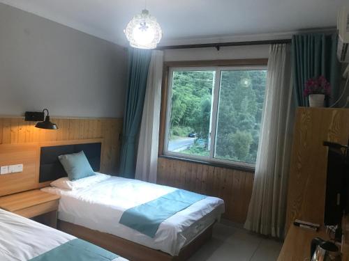 Imagen de la habitación del Anji Mingquan Hotel. Foto 7